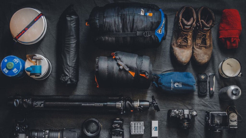 Camping gear and photography gear ready to be packed