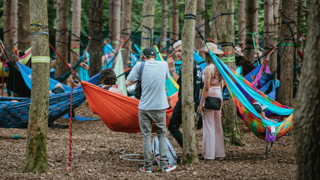 Music festival goers hanging out with hammocks at Electric Forest