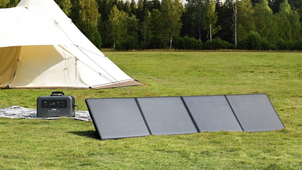 Portable solar panel kit, electric generator, power station setup for camping or music festivals